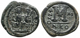 JUSTIN II. 565-578 AD. Æ Follis12,68gr Nicomedia mint. Dated year 11 (575/6 AD). Facing, crowned busts of Justin and Sophia on double throne, he holds...