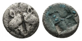 (Silver. 0.60g. 8mm) LESBOS, uncertain mint. 500-450 BC. Obol. 
Two boars’ heads confronted.
Rev: Quadripartite incuse square. 
Rosen.542. SNG.Cop....
