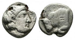 (Silver.0.89g. 11mm) IONIA. Magnesia ad Maeandrum. Obol (Circa 350-325 BC).
Laureate head of Apollo right.
Rev: Forepart of bull left 
Klein 408; (...