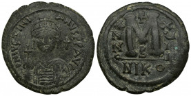 JUSTINIAN I (527-565) AE36 Follis (Bronze, 20.24g, 36mm) Nicomedia. Dated RY 29 (555/6).
Obv: D N IVSTINIANVS P P AVG.
Helmeted and cuirassed bust f...