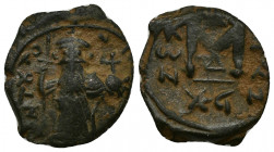 Constans II (641-668) AE17 Follis (Bronze, 3.25g, 17mm), Constantinopolis, RY 15 = 655-656 
Obv: EN T૪TO [NIKA] - Constans II standing facing, bearde...