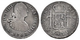 Charles IV (1788-1808). 1 real. 1797. Guatemala. M. (Cal-373). Ag. 3,32 g. Toned. Weak strike. Scarce. Choice VF. Est...90,00. 

Spanish Description...