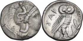 Greek Italy. Southern Apulia, Tarentum. AR Drachm, 302-280 BC. Obv. Head of Athena right, wearing helmet decorated with Scylla. Rev. Owl standing righ...