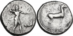 Greek Italy. Bruttium, Kaulonia. AR Nomos, circa 475-425 BC. Obv. Apollo advancing right, holding branch; small daimon running left on Apollo's left a...