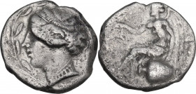 Greek Italy. Bruttium, Terina. AR Nomos, c. 440-425 BC. Obv. Female head left, within olive-wreath. Rev. Nike seated left on hydria, holding wreath in...
