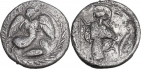 Sicily. Kamarina. AR Litra, 461-440/435 BC. Obv. Nike flying right, above swan swimming right, all within laurel wreath. Rev. Athena standing left wea...