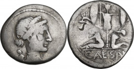 Julius Caesar. AR Denarius, 46-45 BC. Spain. Obv. Diademed head of Venus right; behind, Cupid. Rev. Two captives seated at sides of trophy with oval s...