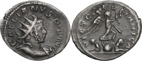 Gallienus (253-268). AR Antoninianus. Cologne mint. Obv. Radiate and cuirassed bust right. Rev. Victory walking right on globe, two captives below. RI...