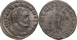 Maximianus (286-310). AE Follis. Lugdunum mint. Obv. Bust laureate, cuirassed, right. Rev. Genius standing, left; holding cornucopia and patera, over ...