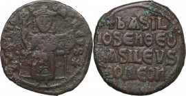 Basil I (867-886). AE Follis. Obv. Basil enthroned facing, wearing crown and loros, and holding labarum and akakia. Rev. Legend in four lines. D.O. 12...