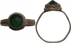 Bronze ring with green glasspaste bezel. Medieval. Inner diameter: 18 mm.