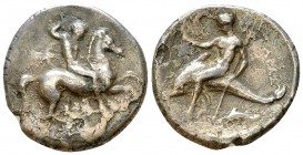 Tarentum AR Nomos, c. 315-302 BC 

Calabria, Tarentum . AR Nomos (22 mm, 7.69 g), c. 315-302 BC.
Obv. Nude warrior, holding two spears and preparin...