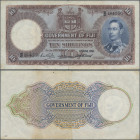 Fiji: Government of Fiji 10 Shillings 1951, P.38k with signatures: Taylor / Donovan / Smith, small border tears and lightly stained paper, Condition: ...