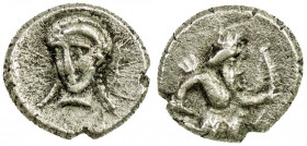 Achaemenid Kingdom. Uncertain Satrap. 4th century B.C AR tetartemorion (6.5 mm, .23 g). Cilicia under Persian Rule. Persian king kneeling, holding bow...