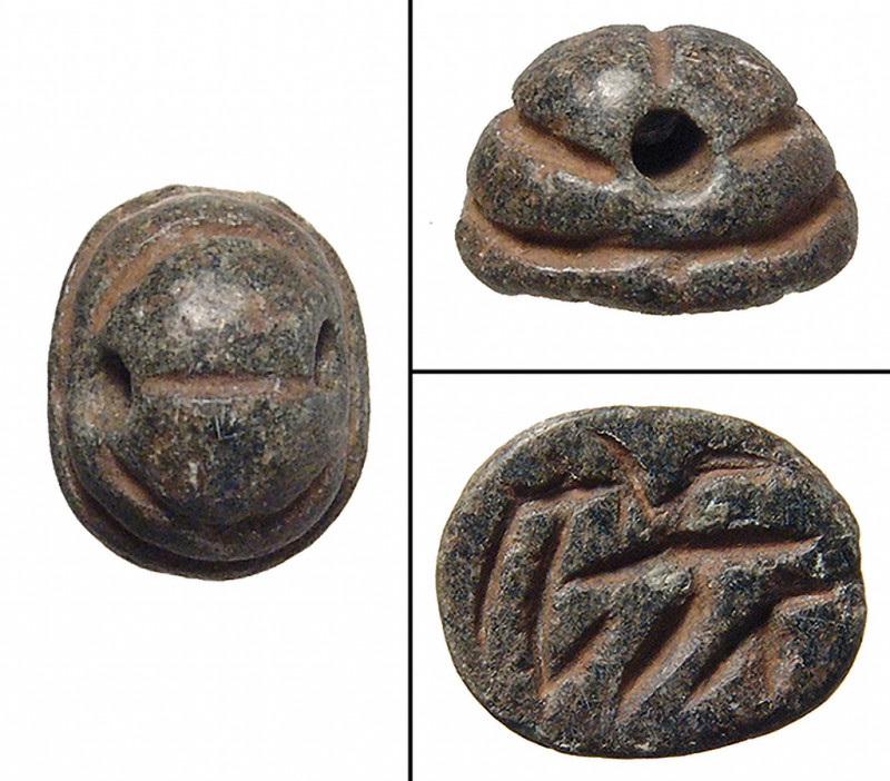 A black-green chlorite pseudo-scarab, North Syria, c. 1000-800 B.C.. A black-gre...