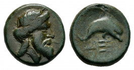 Caria. Myndos. AE 11. Fourth century BC. (Sng Cop-1022). (Sng Kayhan-847/48). Anv.: Laureate head of Poseidon right. Rev.: Dolphin right over trident,...