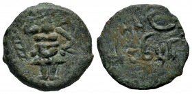 Ebusus. Half unit. 20 a.C. Ibiza. (Abh-949). (Acip-759). (C-59). Anv.: Bes holding mace and snake, punic letter heth left. Rev.: Punic legend. Ae. 5,4...