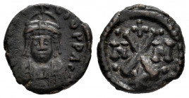 Heraclius. Decanummium. 610-641 AD. Carthage. (Sear-876). Anv.: Front bust with helmet. Rev.: Large X between N-M with dots; cross above; star below. ...
