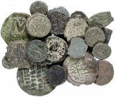 Lote de 26 bronces, entre follis y divisores. A examinar. BC/MBC.
