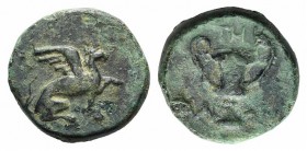 Ionia, Teos, c. 370-330 BC. Æ (9mm, 1.13g, 6h). Metrodoros, magistrate. Griffin seated r., l. paw raised. R/ Kantharos. Cf. SNG Copenhagen 1459. Green...