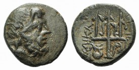 Caria, Halikarnassos, c. 150-50 BC. Æ (17mm, 4.29g, 11h). Head of Poseidon r., wearing tainia. R/ Trident with dolphins between points; kithara to low...