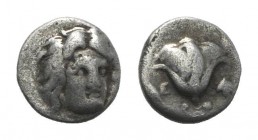 Islands of Caria, Rhodos. Rhodes, c. 305-275 BC. AR Hemidrachm (10mm, 1.53g, 12h). Head of Helios facing slightly r. R/ Rose with bud to l.; to r., gr...