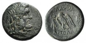 Lydia, Blaundos, c. 2nd century BC. Æ (20mm, 6.81g, 12h). Apollo and Theogens, magistrates. Laureate head of Zeus r. R/ Eagle standing l., head r.; ke...