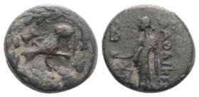 Phrygia, Laodikeia, 1st century AD. Æ (13mm, 2.67g, 2h). Pythes Pythou magistrate. Wolf seated l. with double axe, all within wreath. R/ Aphrodite sta...