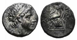 Seleukid Kings, Antiochos III (222-187 BC). AR Drachm (16mm, 3.94g, 11h). Diademed head r. R/ Apollo seated l. on omphalos, testing arrow, resting han...