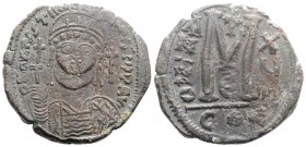 Justinian I (527-565). Æ 40 Nummi (33mm, 18.98g, 6h). Constantinople, year 18 (544/5). Helmeted and cuirassed facing bust, holding globus cruciger and...