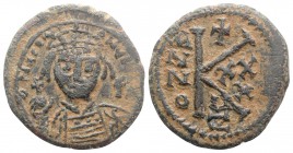 Justinian I (527-565). Æ 20 Nummi (24mm, 6.46g, 6h). Cyzicus, year 30 (556/7). Helmeted and cuirassed bust facing, holding globus cruciger and shield;...