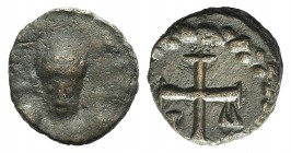 Justinian I (527-565). Æ Nummus (8mm, 0.83g, 12h). Uncertain mint. Helmeted and draped facing bust. R/ Cross potent; ω - Λ across field; all within wr...