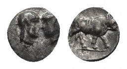 Asia Minor, uncertain mint AR Hemiobol(?). 5th century BC.
Obv: Confronted heads.
Rev: Bull standing right. Unpublished in the standard references, ...