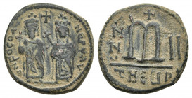 PHOCAS (602-610). Follis. Antioch.
Obv: D N FOCA NE PE AV.
Phocas and Leontia standing facing with globus cruciger and cruciform sceptre; between th...