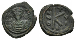MAURICE TIBERIUS (582-602). Half Follis. Constantinople. Dated RY 6.
Obv: D N MAVRIC TIЬЄR P P A.
Helmeted, draped and cuirassed bust facing, holdin...