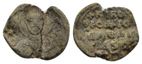 BYZANTINE LEAD SEALS. Theodoros (Circa 11th century).
Obv: Facing bust of St. George, holding spear and shield.
Rev: Legend in four lines.
.
Condi...