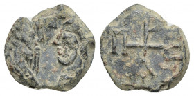 BYZANTINE LEAD SEALS. Uncertain (Circa 8th-9th centuries).
Obv: Draped busts (of two saints?) facing one another; cross above.
Rev: Monogram.
.
Co...