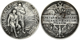 Poland Medal Russians to Polish Brothers 1914; medal with the signature A.ЖАКАРЪ. Obverse: A standing Russian has his hand on the shoulder of a sittin...