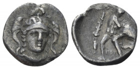 Calabria, Tarentum Diobol circa 280-228, AR 11.00 mm., 0.98 g.
Facing helmeted head of Athena, slightly r. Rev. Heracles fighting Nemean lion; in l f...