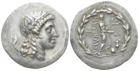 Aeolis, Tetradrachm circa 155-145, AR 32.00 mm., 14.91 g.
Laureate head of Apollo r. Rev. ΜΥΡΙΝΑΙΩΝ, Apollo of Grynium standing r., holding filleted ...