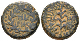 Judaea, Tiberias Herod III Antipas, 4 BC-39 AD Unit circa 30-31, Æ 19.00 mm., 7.96 g.
Mint in two lines within wreath. Rev. Palm frond; in field, L-Λ...