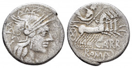 CN. PAPIRIUS CARBO.(122 BC).Rome.Denarius.

Obv : Helmeted head of Roma right; X behind.

Rev : CARB ROMA.
Jupiter driving quadriga right, holding sce...