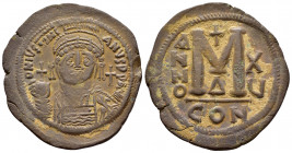 JUSTINIAN I.(527-565).Constantinople.Follis.

Obv : D N IVSTINIANVS P P AVC.
Helmeted, cuirassed bust facing, holding cross on globe and shield wit...