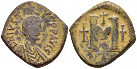 JUSTIN I.(518-527).Antioch.Follis.

Obv : DN IVSTINVS PP AVGS.
Diademed, draped and cuirassed bust right.

Rev : Large M, cross to left, cross above, ...