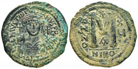 JUSTINIAN I.(527-565).Nicomedia.Follis. 

Obv : DN IVSTINIANVS PP AVG.
Helmeted, cuirassed bust facing, holding cross on globe and shield with horsema...