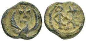 BYZANTINE LEAD SEAL.(Circa 11 th Century).Pb.

Obv : An eagle with its wings outspread.Cross above.Wreath border.

Rev : Cruciform invocative mono...
