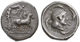 CLASSICAL COINS 
 SICILY 
 SYRACUSE 
 Tetradrachm, about 490-485 BC. AR 16.97 g. Slow quadriga r., the charioteer wearing long chiton and holding r...