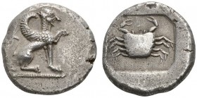 CLASSICAL COINS 
 LYCIAN DYNASTS 
 Stater, about 500-480 BC. AR 9.19 g. Sphinx with curved wings seated r. on dotted ground line, raising its l. for...