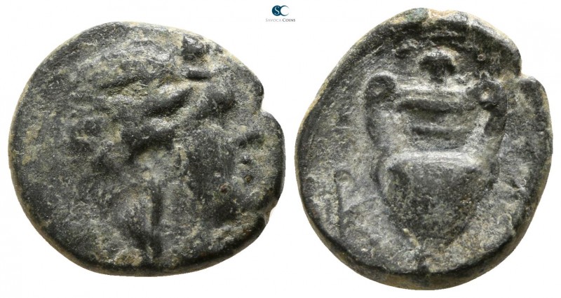 Corcyra. Corcyra 300-200 BC. 
Bronze Æ

13mm., 2,71g.

Head of Dionysos wit...
