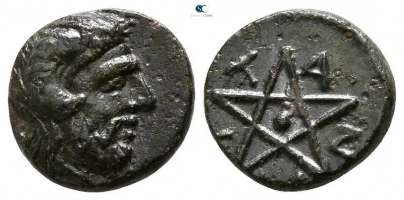 Troas. Pitane circa 300 BC. 
Bronze Æ

9mm., 1,25g.

Head of Zeus Ammon rig...